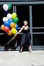 Blond with balloons out in the sun