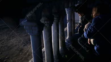 Children refugees against the backdrop of bombed houses. war
