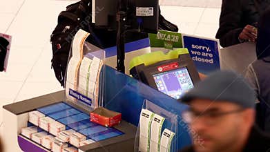 Top shot of people buying lottery ticket inside mall