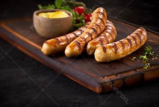 Four succulent grilled pork sausages