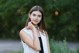 Young girl on nature shows emotions