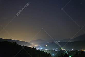 Mountain view at night with stars