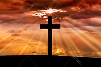 Jesus Christ wooden cross on a scene with dark red orange sunset,