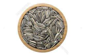 sunflower seeds in wooden bowl isolated top view on white background