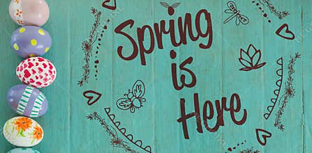 Composite image of spring is here logo against background