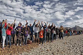 People in a peaceful demonstration on a beach to protect it from construction