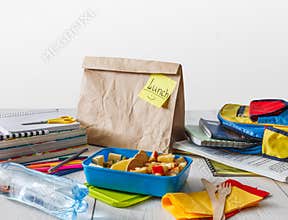 Healthy school lunch in box on white wood table background