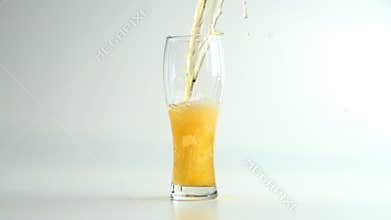 Pouring beer into the glass in slow motion