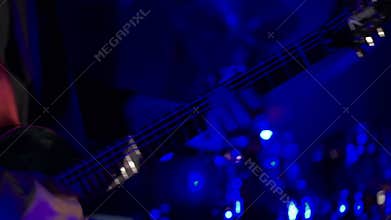 Man playing guitar in nightclub