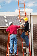 Workers Install Solar Panels