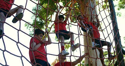 Trainer training kids in the boot camp