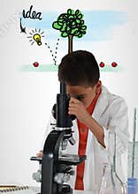 Schoolboy scientist in lab with colorful idea graphics