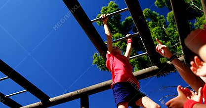 Trainer training kids in the boot camp