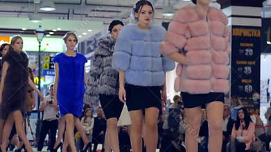 Fashion Defile show, Stylish Fur coats On models Going on catwalk, presentation of new collection of winter clothing