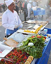 Man sells Fish Sandwich near the Galeta Bridge market in Istanbul Turkey