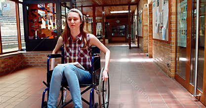 Portrait of disabled schoolgirl in corridor