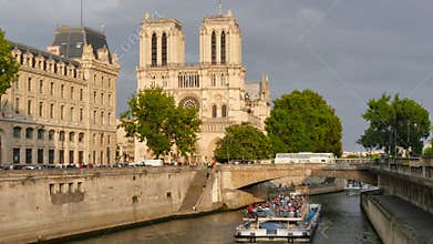 Notre Dame view from the River Seine in Paris at sunset