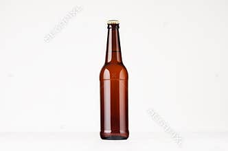 Brown longneck beer bottle mock up. Template for advertising, design, branding identity on white wood table.