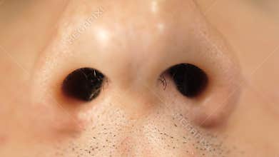 Nostrils of a man`s nose