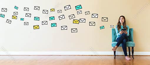 Emails with young woman holding a tablet