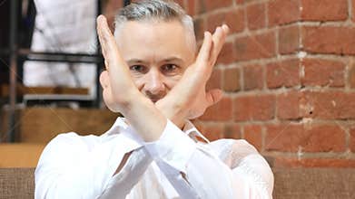 No, Rejecting Gesture by Middle Age Man