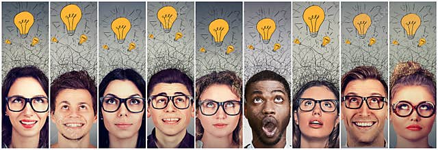 Group of people men and women with many ideas light bulbs above head looking up.