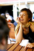 Woman in a happy conversation at coffee