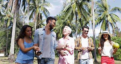 People Group Talking Communication Walk Outdoors Through Palm Trees, Happy Smiling Mix Race Man And Woman Friends