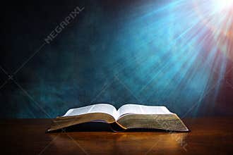 Open Bible on a wood table