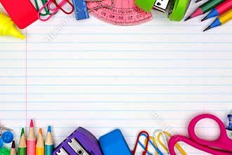 School supplies double border on lined paper background