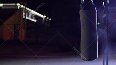 Gym, punching bags. Punching bags in boxing room, sport. Punching bag at the dark sports ground