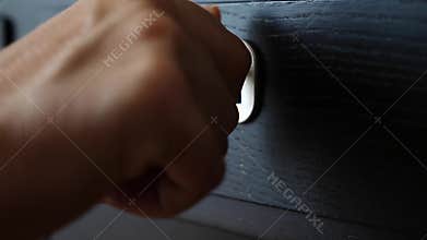 Someone turns the key in the keyhole of the safe box. close-up. 4k, slow motion.