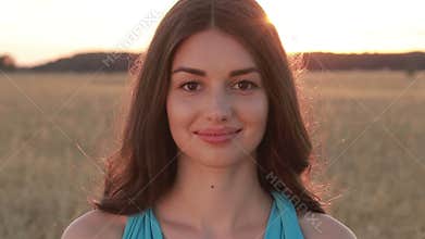 Summer portrait of charming woman at sunset