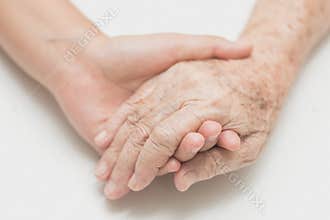 Help concept,The helping hands for elderly home care.