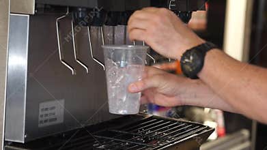 Man selecting cool fountain drink