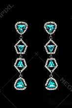 Earrings with blue stones on the black