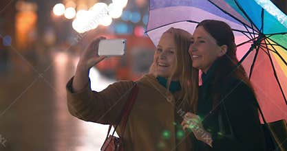 Female Friends Taking Selfie on Smartphone