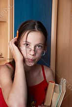 Girl with books and pencil