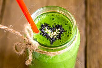 Green smoothie with heart of seeds