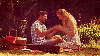 Handsome man doing marriage proposal to his girlfriend