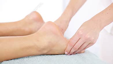 Physiotherapist doing a foot massage