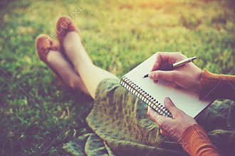 Hands with pen writing