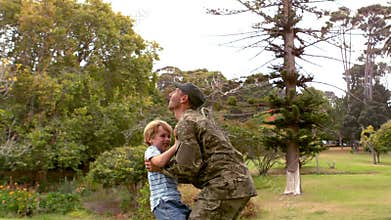 Happy soldier reunited with his son