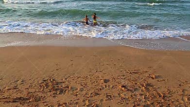 Kids run to swim in the sea