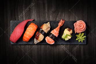 Sushi on black stone plate