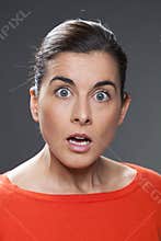 Shocked 30s girl expressing misunderstanding