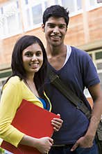 Male and female college students on campus