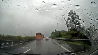 Absent-minded driver driving a brand new car and hits a bus on the other lane