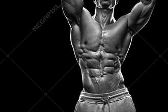 Handsome athletic man working out with dumbbells