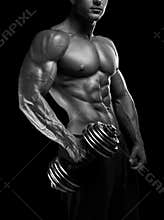 Strong and power bodybuilder doing exercises with dumbbell
